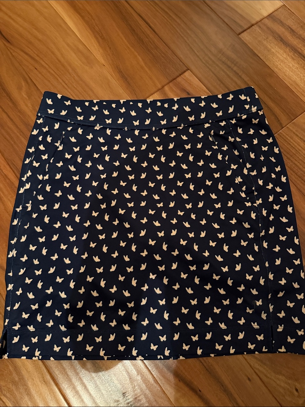 Belyn Key Navy Blue Mini Skort with White and Orange Butterfly Print